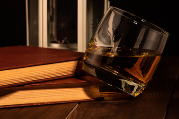books, glass and whisky