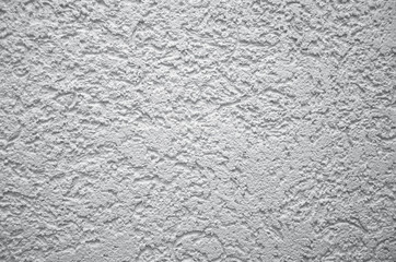 The rough cement wall of the house. Toning in Ultimate Gray, trend 2021. Plasterer indoors, wall...