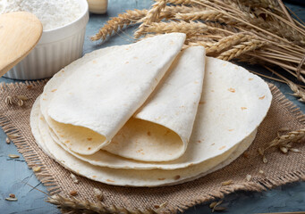 Tortilla cake, pita, on a dark blue background.