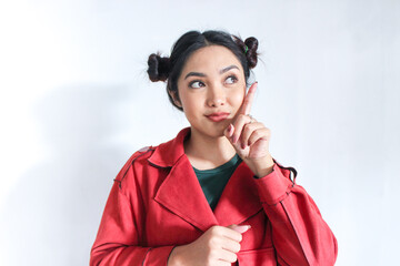 Young chinese woman with praying gesture wishing you good luck with happy and smile face....