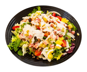 close up of mediterranean cabbage salad in black bowl for lunch. Isolated over white background