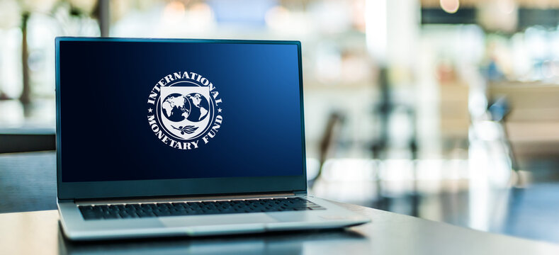  Laptop displaying logo of The International Monetary Fund (IMF)