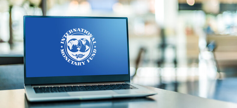  Laptop displaying logo of The International Monetary Fund (IMF)