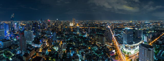 Fototapeta premium Bangkok business district cityscape with skyscraper at twilight, Thailand - Panorama