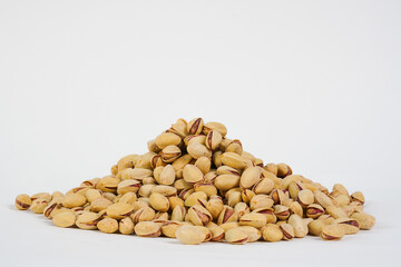  Pistachio nuts on white background.  Product for sale.  Copy space. Studio photo.