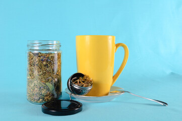 Cup of tea on a saucer with ingredients