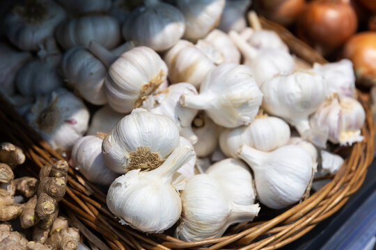 Garlic in a basket on a supermarket shelf