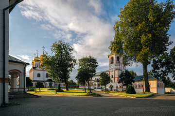 View of the Bell Tower and Assumption Cathedral on the territory of the Valdai Iversky Monastery. Valdaysky District of Novgorod Oblast, Russia. August 2020.