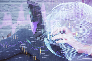Multi exposure of woman hands typing on computer and forex chart hologram drawing. Stock market analysis concept.