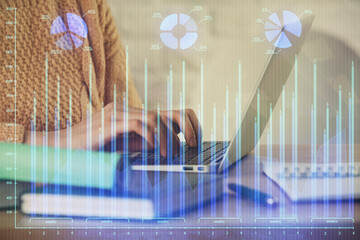 Double exposure of woman hands typing on computer and forex chart hologram drawing. Stock market analysis concept.