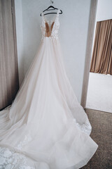 Fototapeta na wymiar beautiful wedding dress in a bright room