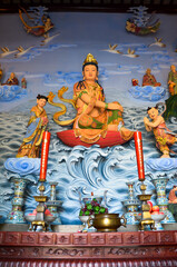 Buddhist picture art on the wall in a chinese temple.