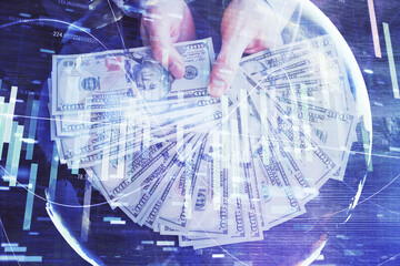 Multi exposure of financial theme drawing hologram and USA dollars bills and man hands. Business concept.