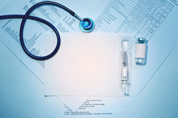 Antiviral vaccine in a unit dose syringe over laboratory reports.