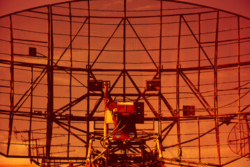 Large radar installation against a bright sky. Military locator close-up. Metal construction background - 406076306