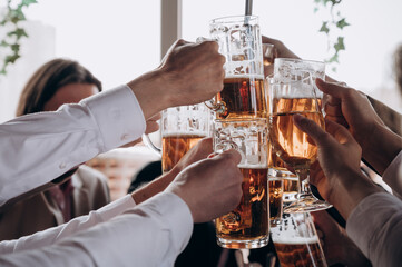 guys with beer mugs in their hands