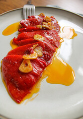 Spanish Piquillo peppers with garlic and olive oil. Spanish tapas dish. 