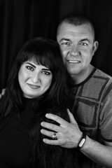 Black and white photoshoot of a couple in the studio
