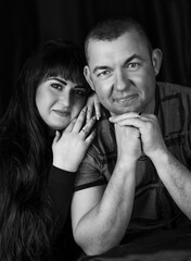 Black and white photoshoot of a couple in the studio