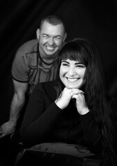 Black and white photoshoot of a couple in the studio