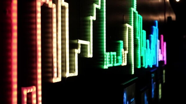 Colorful and interchangeable city graphs made with led light bulbs.
