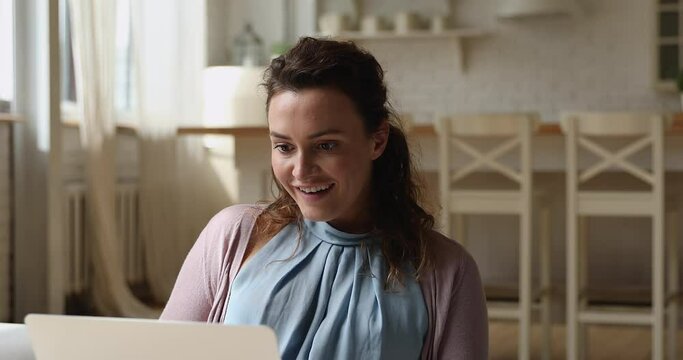 Woman sitting on couch check e-mail on laptop reading great news feels overjoyed. Internet sale, commercial offer, discounts, on-line lottery victory, gambler celebrate betting bookmaker win concept