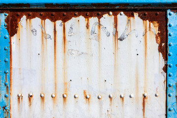 White peeling paint rust texture grunge background of a white painted vintage cast iron textured...