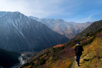 Fototapeta na wymiar Young woman hiking in Ala Archa National Park, Kirgyzstan