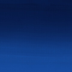 Blue ink and watercolor texture on white paper background. Gradient paint strokes and decalcomania effect. Hand-painted gouache abstract image. Mess on the canvas.