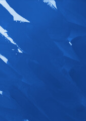 Blue ink and watercolor texture on white paper background. Gradient paint strokes and decalcomania effect. Hand-painted gouache abstract image. Mess on the canvas.