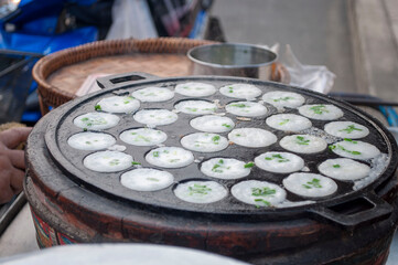 Kanom Krok, a traditional Thai dessert made from crushed coconut meat.