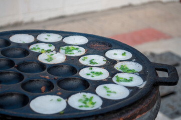 Kanom Krok, a traditional Thai dessert made from crushed coconut meat.