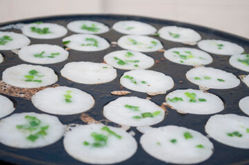 Kanom Krok, a traditional Thai dessert made from crushed coconut meat.
