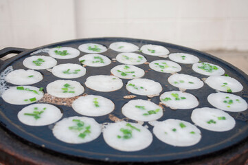 Kanom Krok, a traditional Thai dessert made from crushed coconut meat.