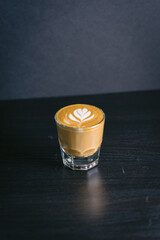 Cup of coffee on a table cortado