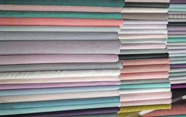 Pastel colored cotton fabric in a shop.