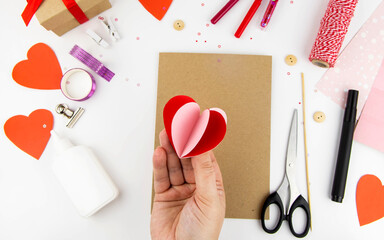 Valentine's Day. Instructions for making cards for Valentine's Day. Step 3 bend the hearts and glue them together in halves.