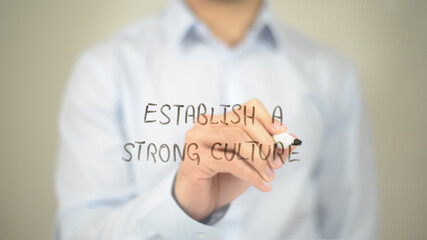 Establish a Strong Culture, Man writing on transparent screen