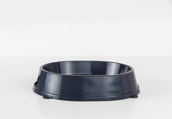 Empty grey bowl for feeding the cat on a white background.