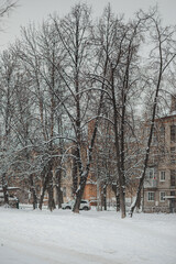 Street of the Russian city in a snowfall. Old district, mid-20th century. Trees in winter.
Russia, Ryazan