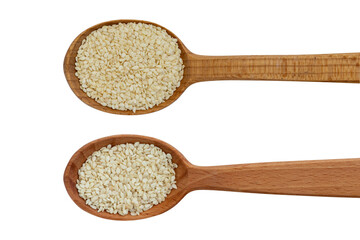 Sesame seeds on wooden spoon, isolated on a white background