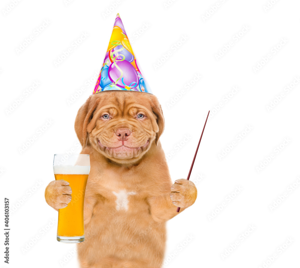 Aufkleber dog wearing party cap holds glass of beer and points away on empty space. isolated on white backgrou