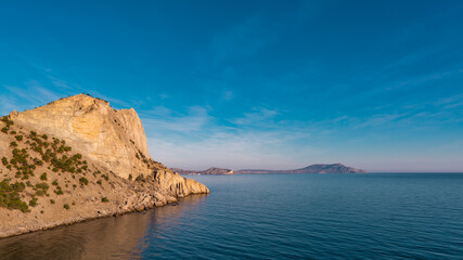 Fototapeta na wymiar Landscape view on mountains and Black sea in Crimea, Sudak with colorful sky