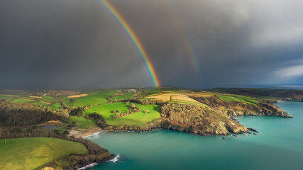 Rainbow at Caerhays bay, Cornwall, UK.