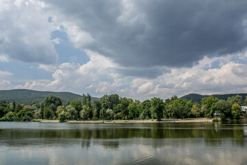 Beautiful peaceful nature, trees and plants on a lake, summertime season, reflection in the water, Zagorka lake, Stara Zagora, Bulgaria