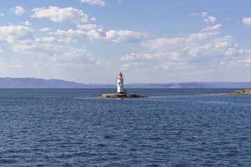 Lighthouse Tokarevskaya cat view from sea on sunny day