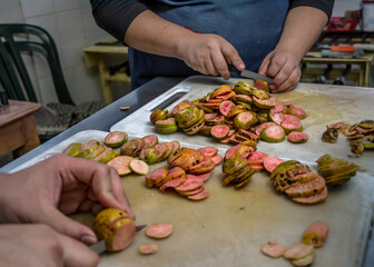 Cutting slices of  pink guavas. Healthy, organic , exotic fruit.