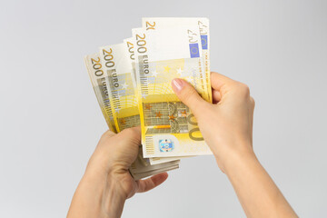 200 euro banknotes count by woman