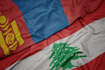 waving colorful flag of lebanon and national flag of mongolia.