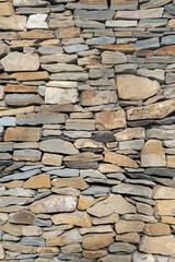 Natural stone masonry wall texture or background